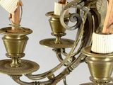 a chandelier that has a bunch of candles on it