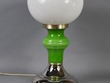 an image of a green and white lamp on a silver base