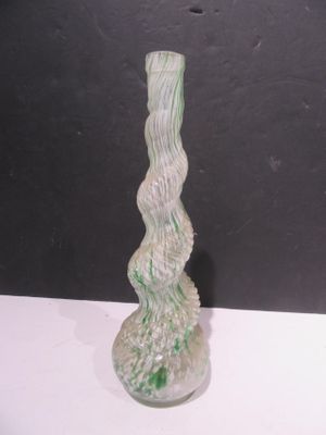 a glass vase that is sitting on a table