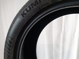 a close up of a tire on a white surface