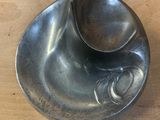 a spoon and a spoon rest on a wooden table