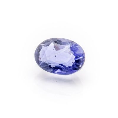 an oval tanzane blue sapphire gems on a white background