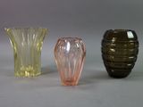 three vases sitting next to each other on a table