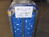 a blue cart with a sign on it in a warehouse