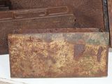 a rusted piece of metal sitting on a table