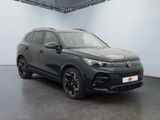a black volkswagen suv parked in a large room