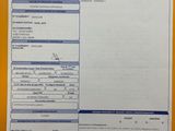 a close up of a yellow folder with a receipt on it