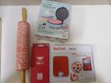 a box of cookies and a rolling pin on a table
