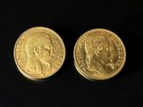 two gold sovereigns, one with the head of a man and one with a woman