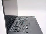a laptop computer sitting on top of a white table
