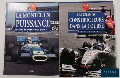 two books on a white table with a picture of a racing car