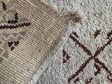 a close up of a rug on a wooden floor