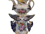 a blue and white vase with a bird on it