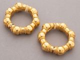 pair of gold - plated hoop earrings with beading