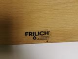 a close up of a wooden shelf with a clock on it