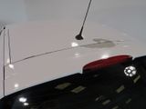 an apple logo on the back of a white car