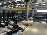 a large warehouse filled with lots of steel pipes