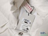a label on a white jacket with a tag on it