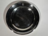 a silver plate that is on a white table