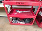 a red work bench with a bunch of shoes on it