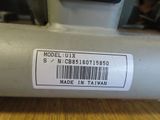 a label on a sewing machine that is on a table