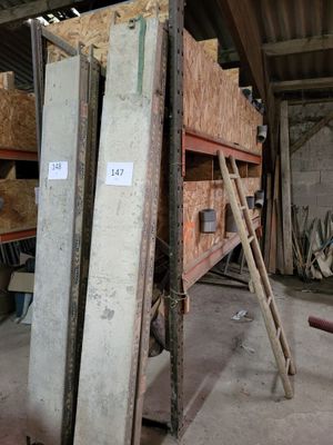 several pieces of wood stacked on top of each other in a warehouse