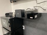 many different types of electronic equipment on a shelf