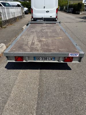 an image of a flat bed trailer parked in a parking lot