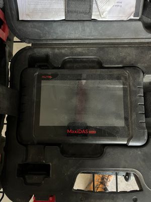 an open case with a computer inside of it on a table