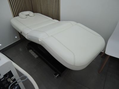 an image of a white massage table in a room