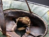 a small bird that is sitting inside of a leaf