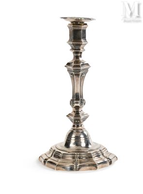 a close up of a silver candle holder on a white background