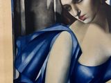 painting of a woman in a blue dress holding a guitar
