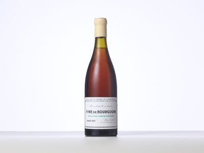 a bottle of wine that is sitting on a table