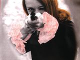 french poster of a woman pointing a gun at the viewer