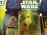 several star wars action figures are displayed on a white surface