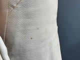 a close up of a person wearing a white shirt and tie