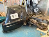 a helmet that is sitting on a table in a garage