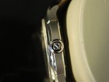 an image of a close up of a watch on a black surface