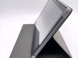 a tablet that is sitting on top of a stand