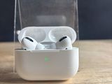 an apple airpods are sitting in a clear case on a wooden table