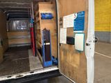 the back of a van with the door open and the back of the van with the door open