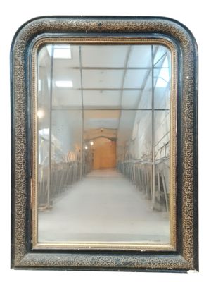 a mirror that is sitting on the wall in the room