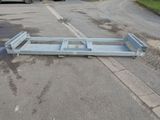 an image of a flat bed in the middle of a parking lot