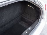 a trunk of a car that is empty with the door open