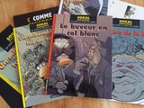 several books on a table with one of the covers pulled up