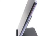 a close up of a cell phone on a stand
