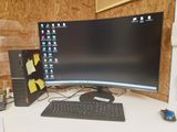 a desktop computer sitting on a desk with a keyboard and mouse