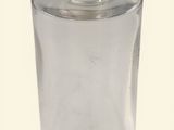 a clear glass jar with a wooden lid on a white surface