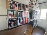 a room with a lot of boxes and boxes on the shelves